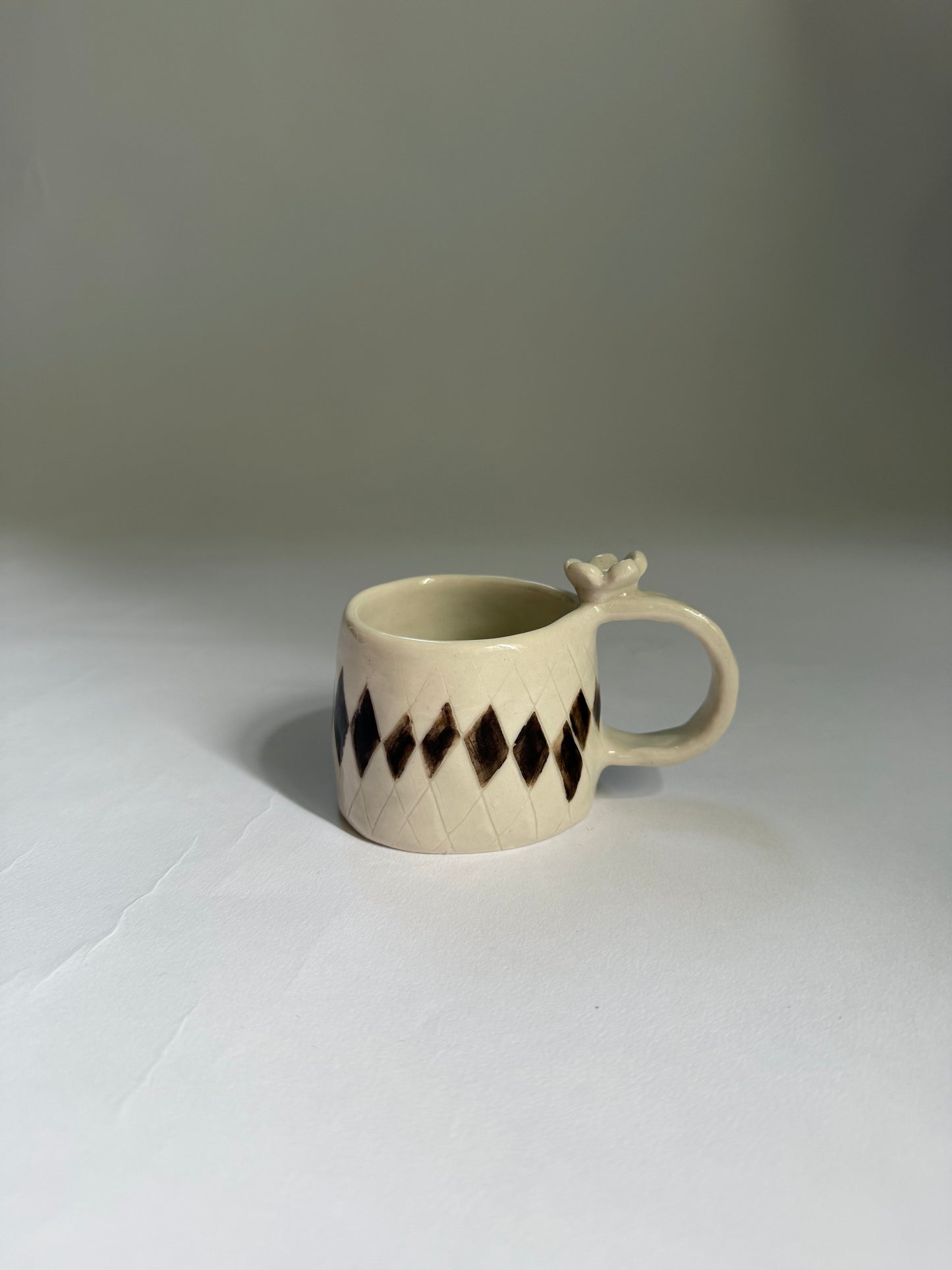 flower topped espresso cup