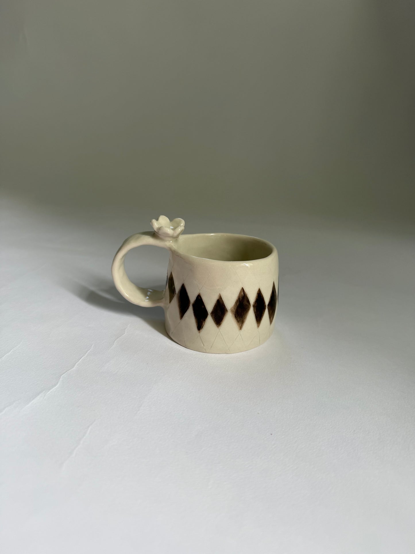 flower topped espresso cup