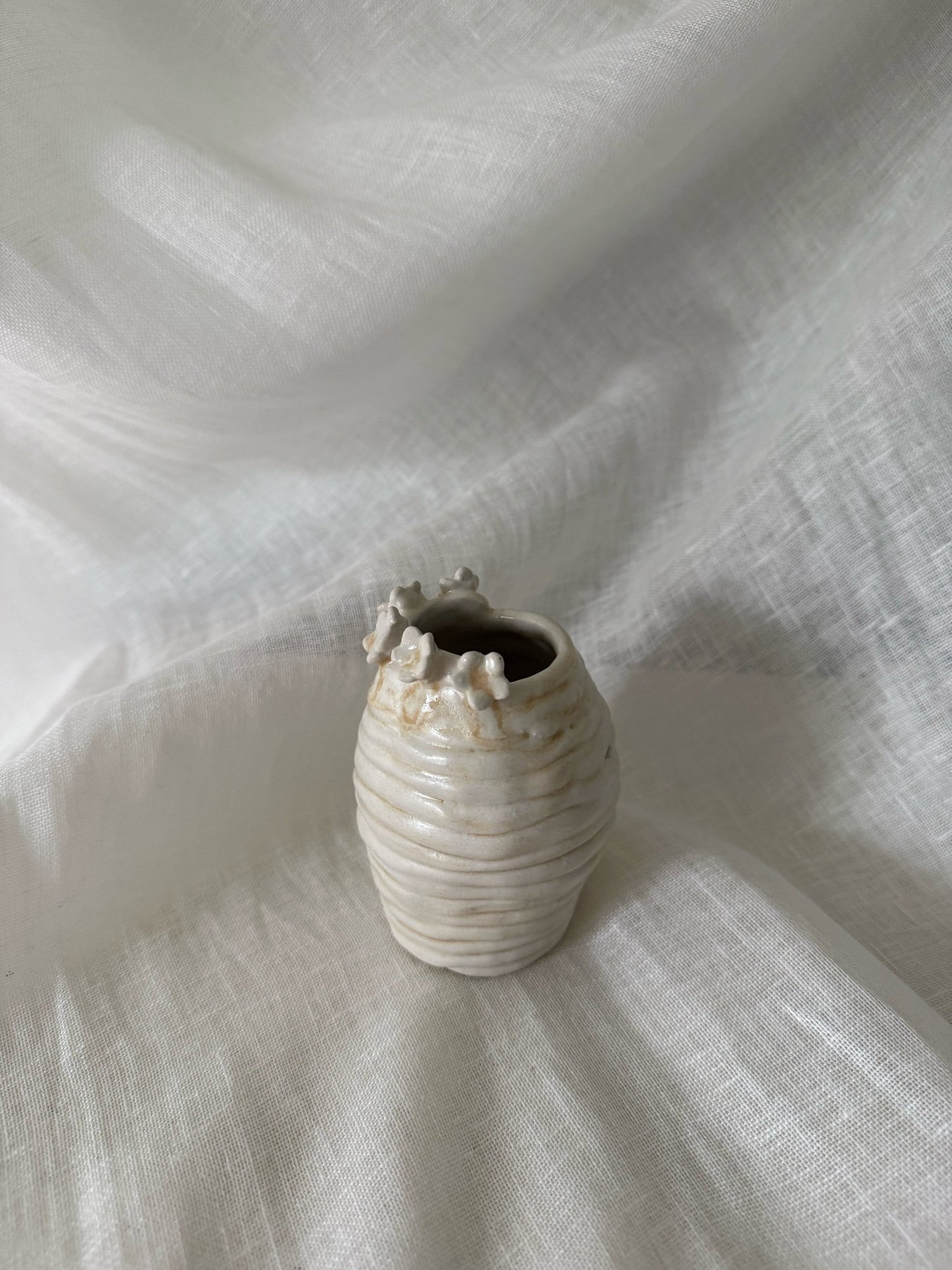 flower rimmed bud vase