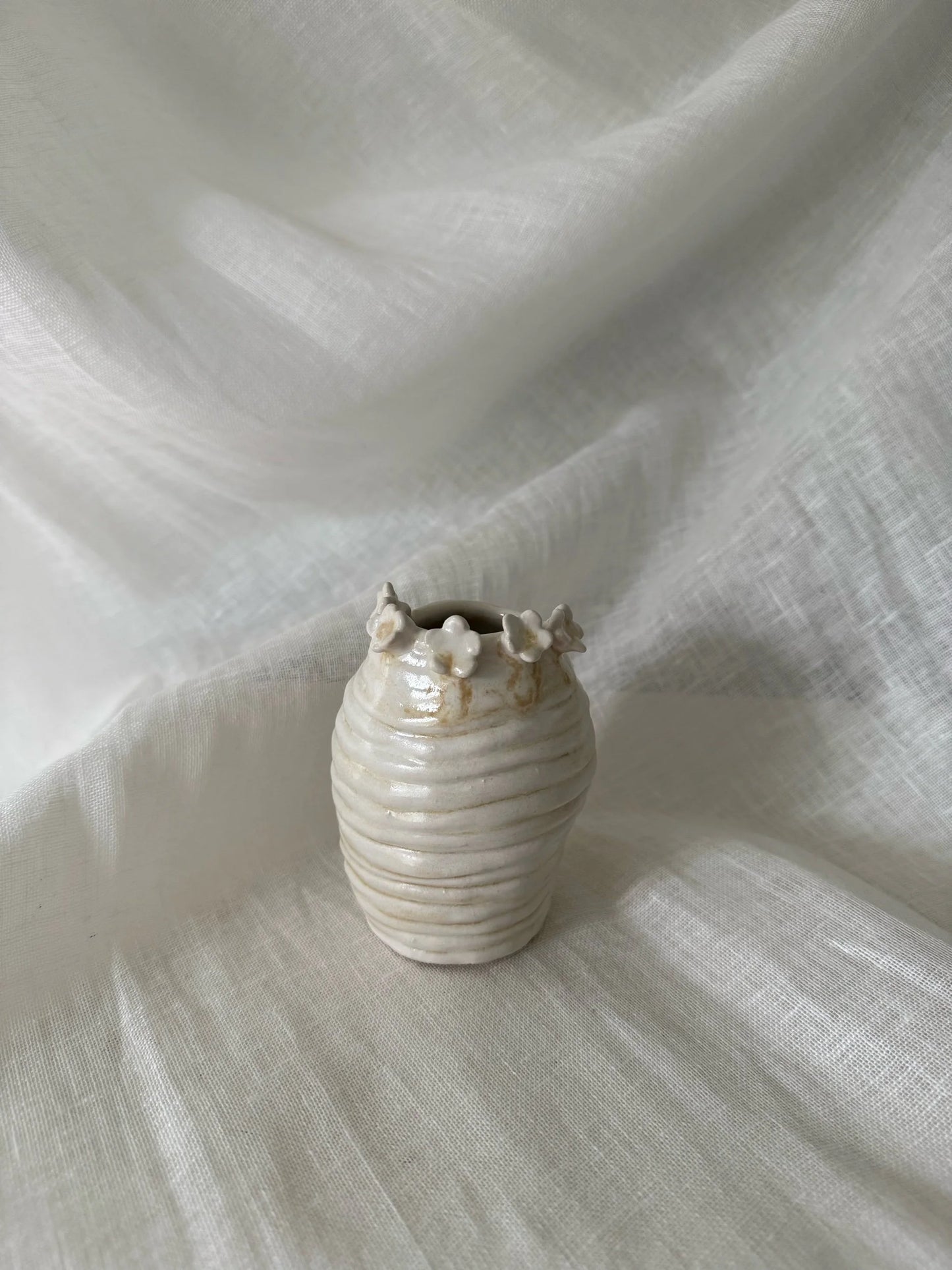flower rimmed bud vase