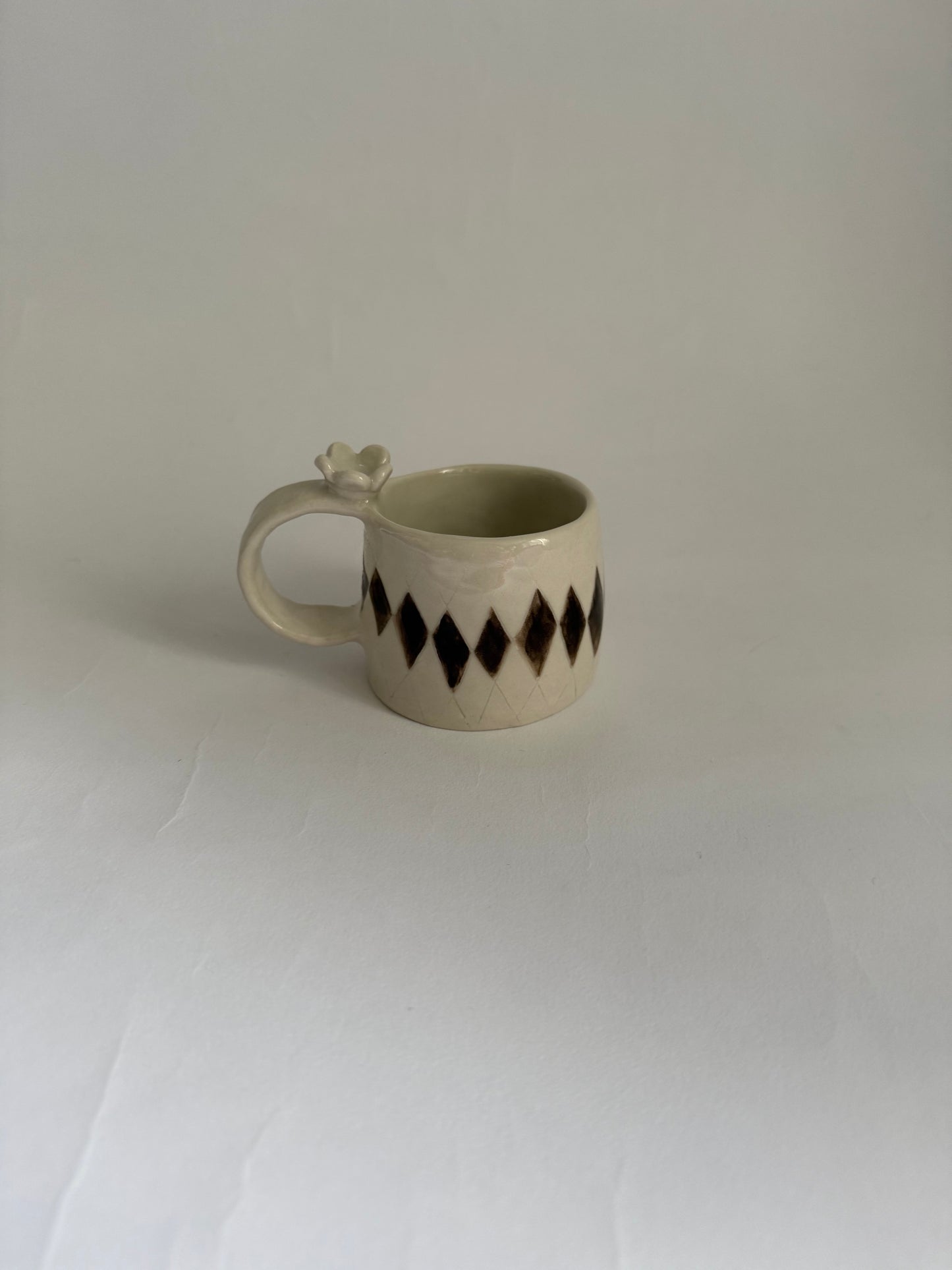 flower topped espresso cup