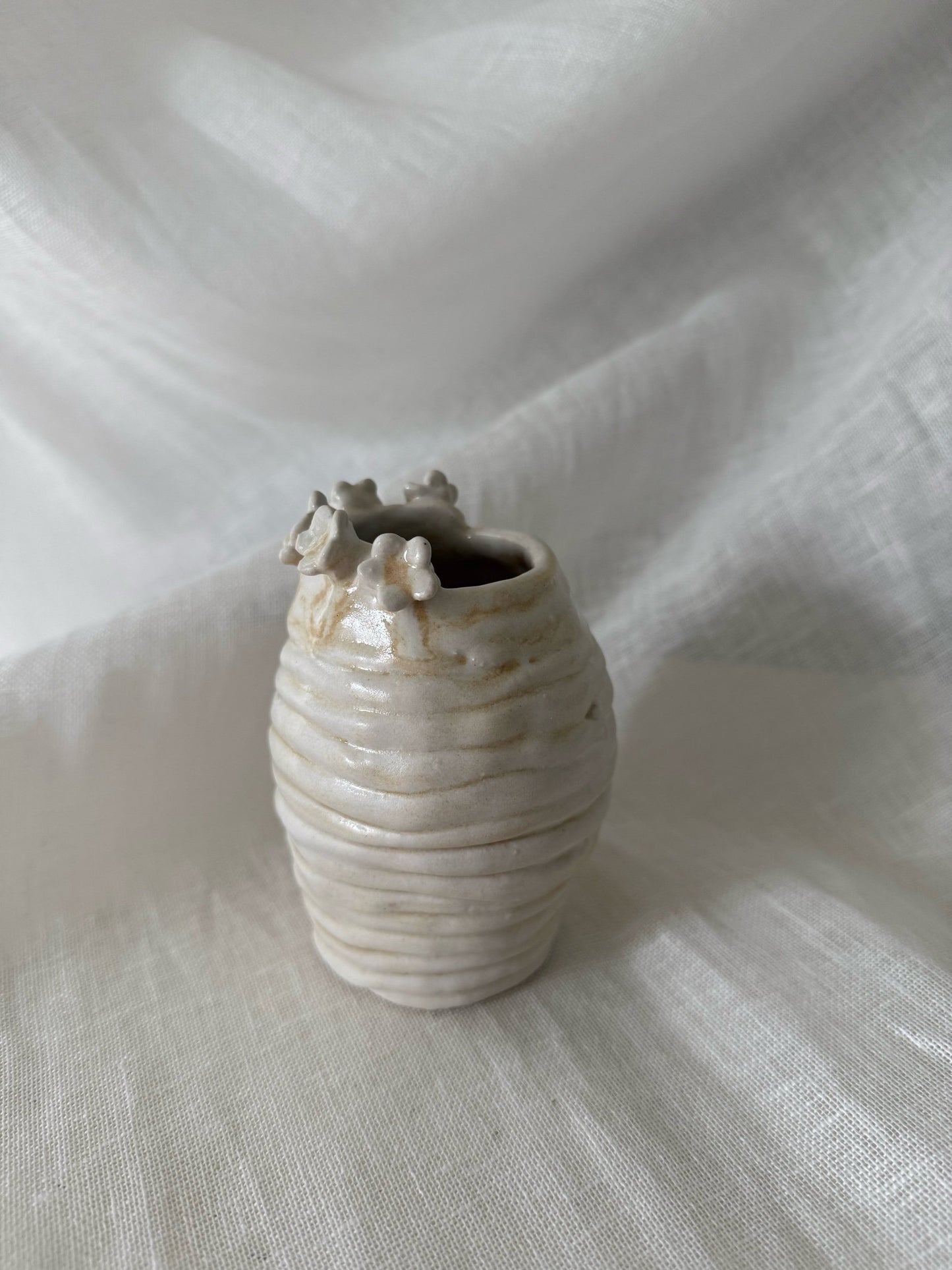 flower rimmed bud vase