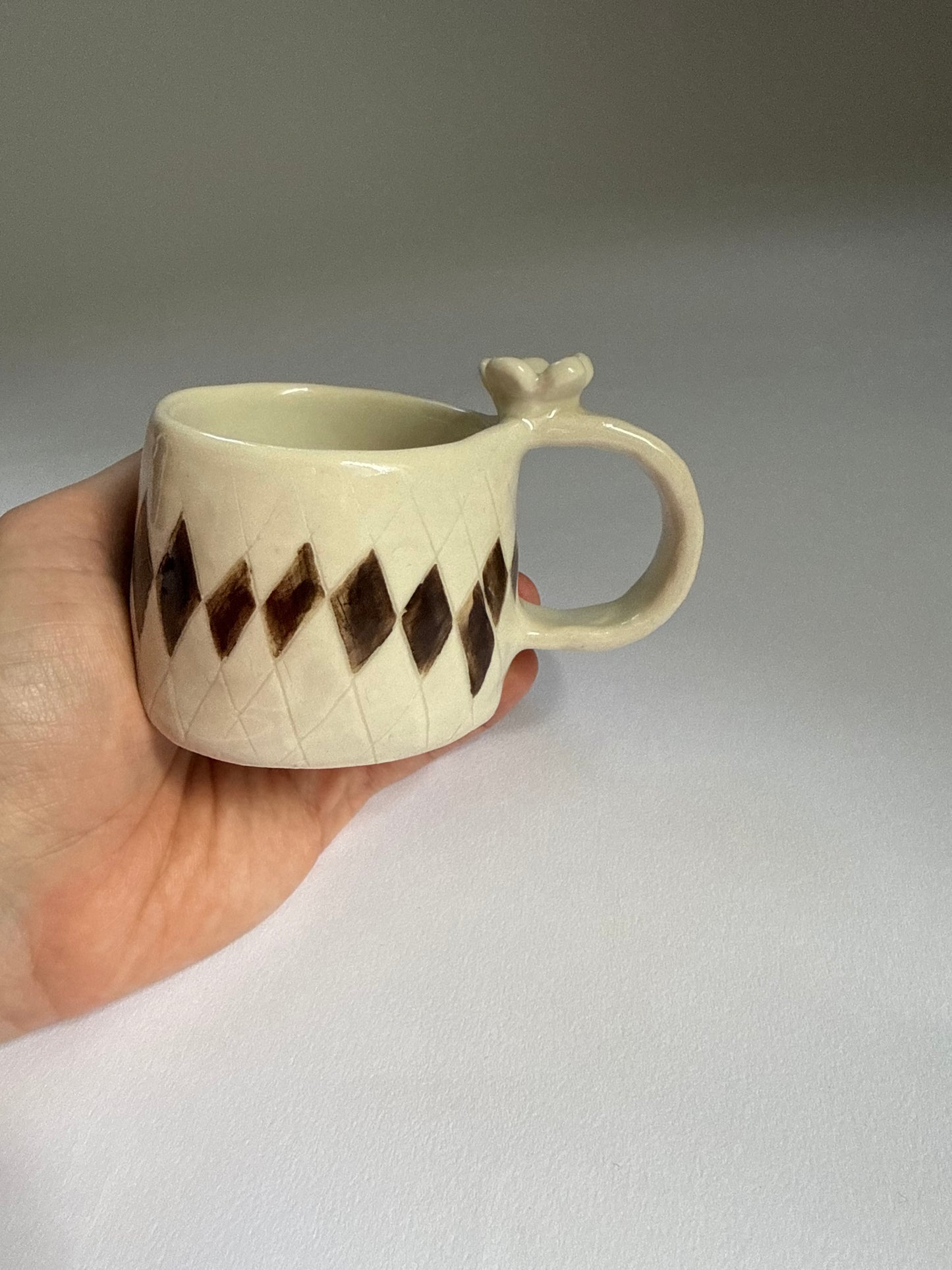 flower topped espresso cup